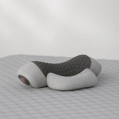 oreiller ergonomique gris sur lit